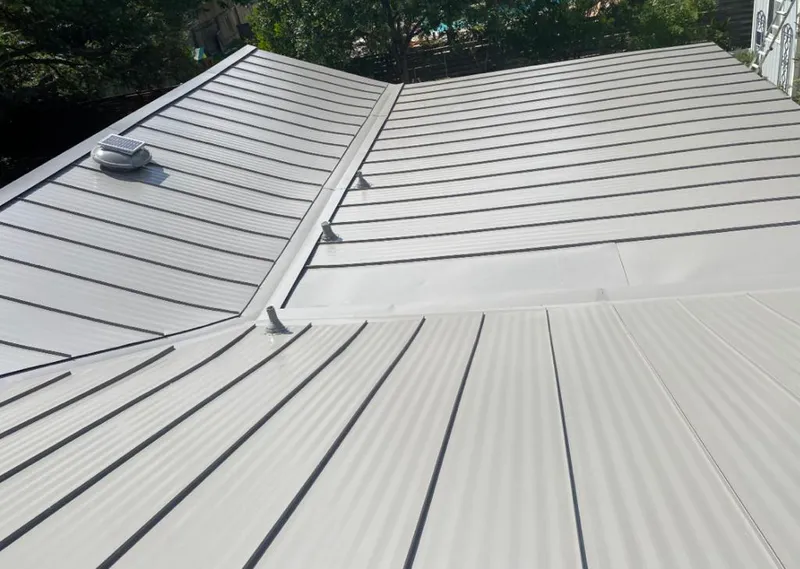 Solar attic fan installed on a metal roof for Roof Ventilation in Nolanville